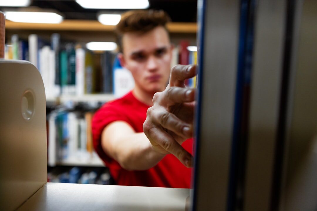 person using laptop in library